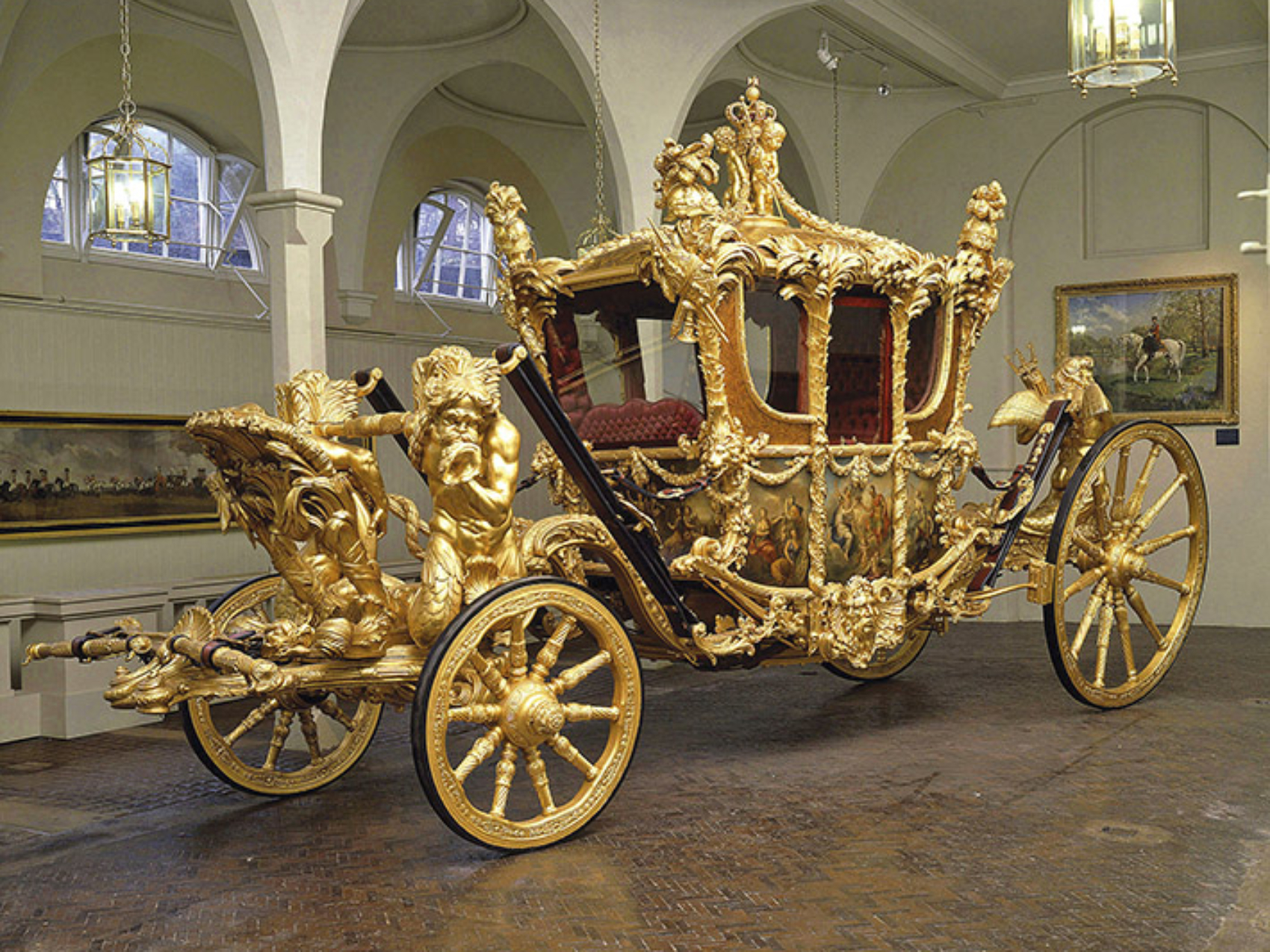 The Royal Mews, Buckingham Palace
	
27 March – 31 October 2004
The Gold State Coach
	
The Royal Collection © 2004, Her Majesty Queen Elizabeth II
This photograph is issued to end-user media only. It may be used once only and only to preview or review the opening of the Royal Mews 2004. Photographs must not be archived or sold on.
Public Relations & Marketing, the Royal Collection: 020-7839 1377