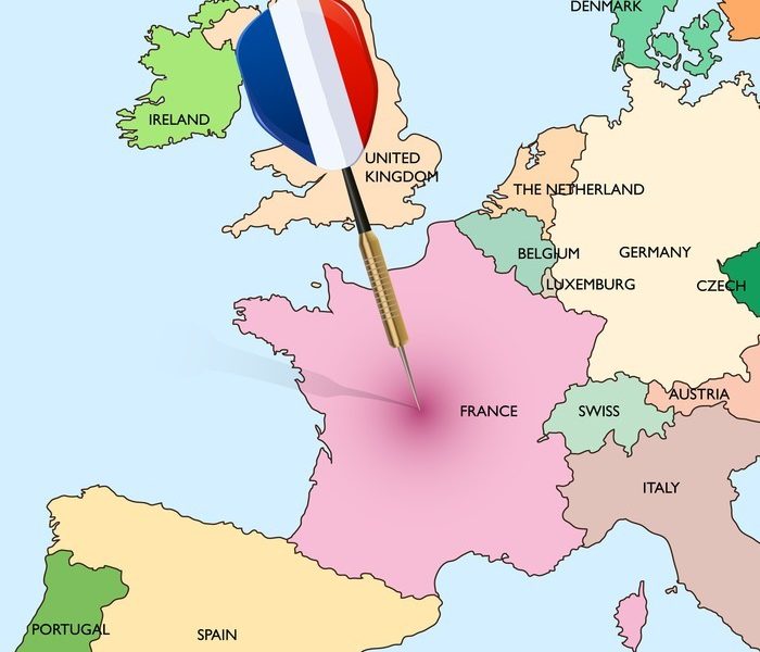 Target - France. Dart hitting in France on Europe map.
